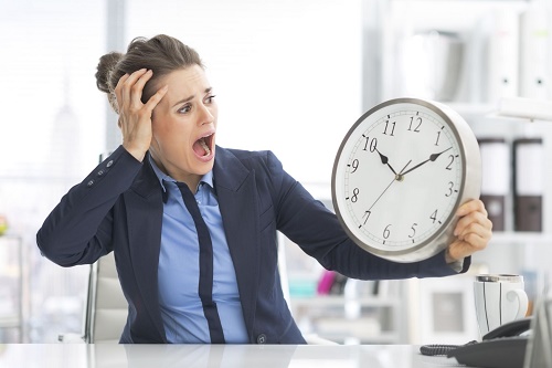 stressed woman looking at clock